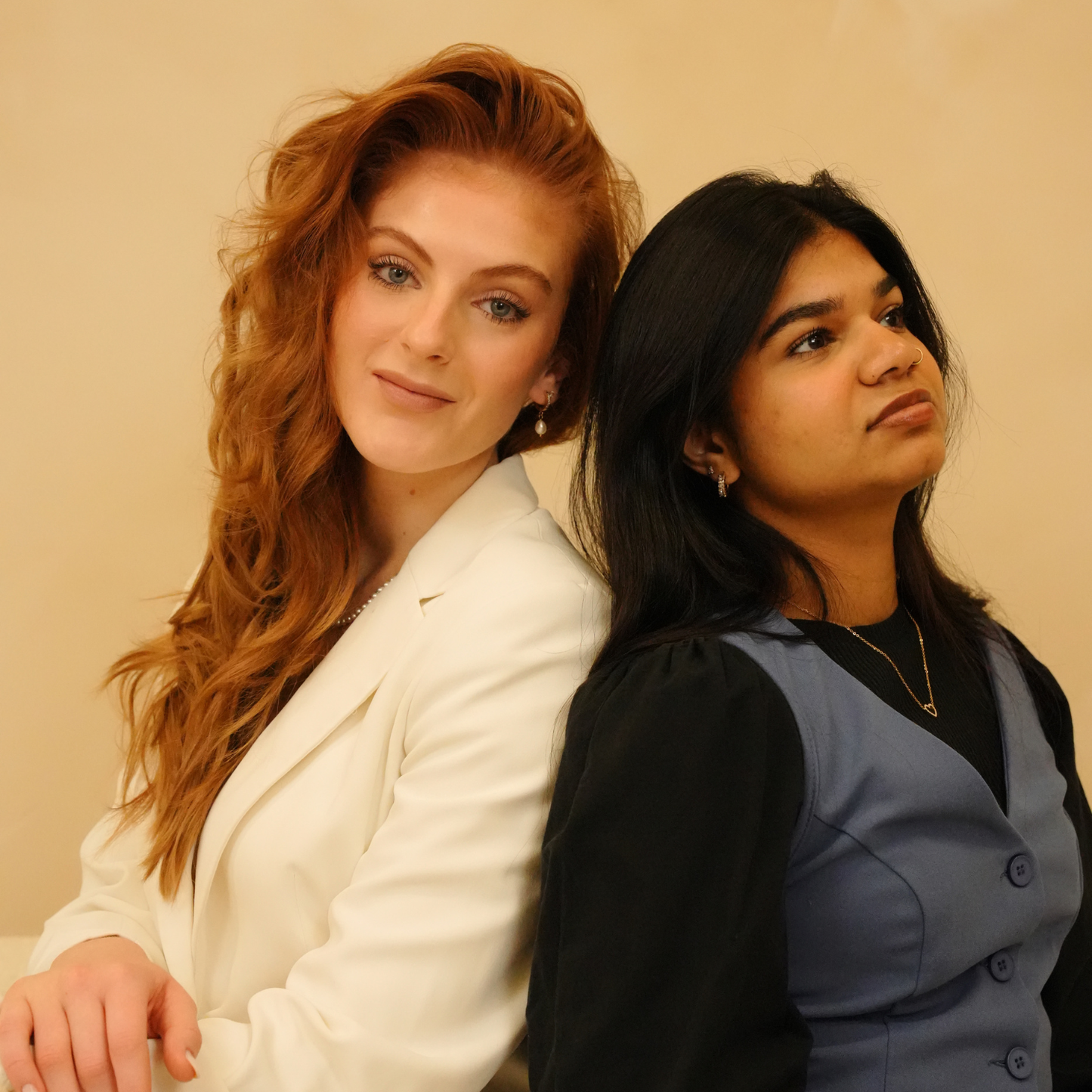 Gold necklace with a heart pendant with no brand attribution, as worn by a person.