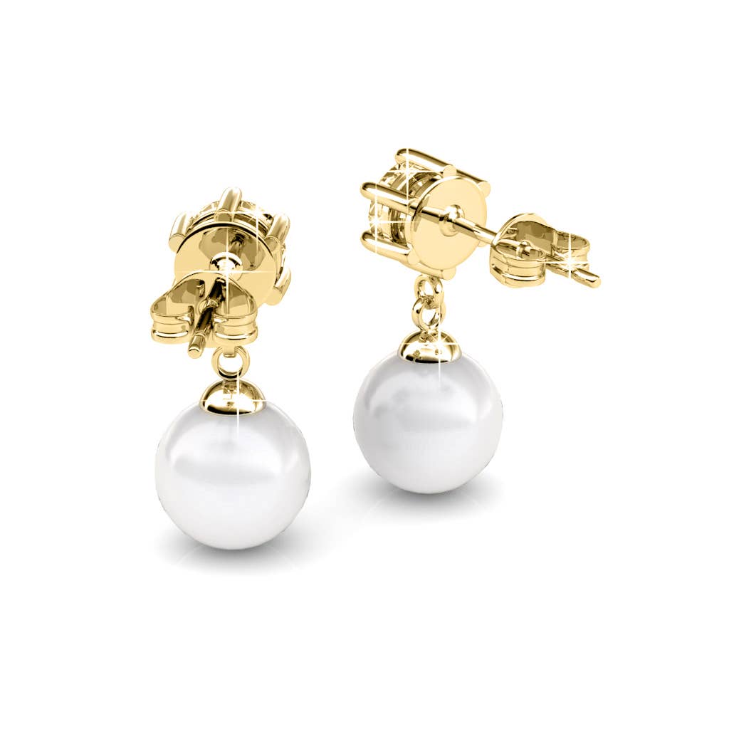 Gold earrings with white pearls on a white background