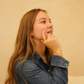 Gold ring with layered band detailing, Kyla Ring, worn with a denim shirt and gold bracelet