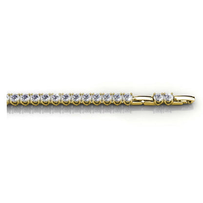Gold bracelet with diamonds on a white background