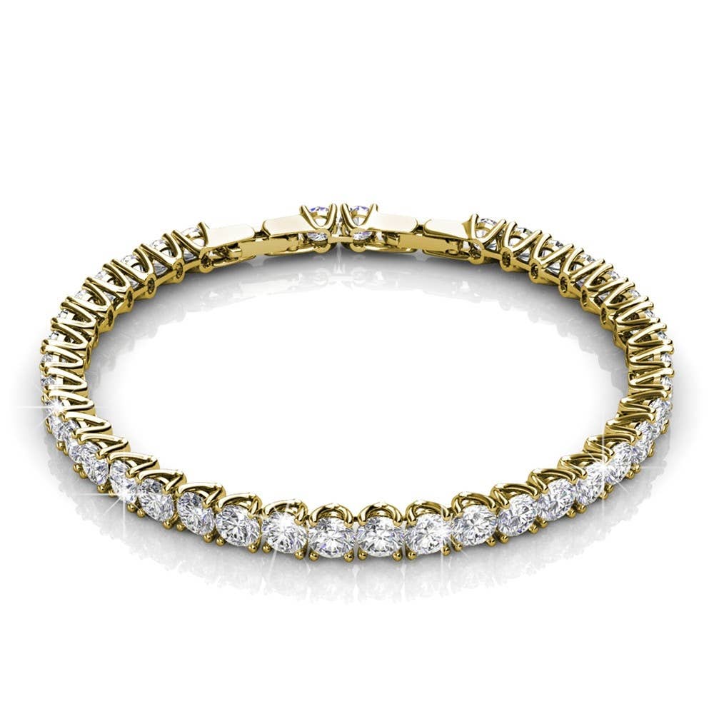 Gold bracelet with clear gemstones on a white background