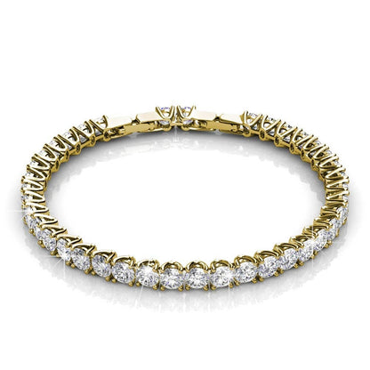 Gold bracelet with clear gemstones on a white background