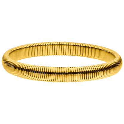 Gold flexible bracelet by unknown vendor on a green background.