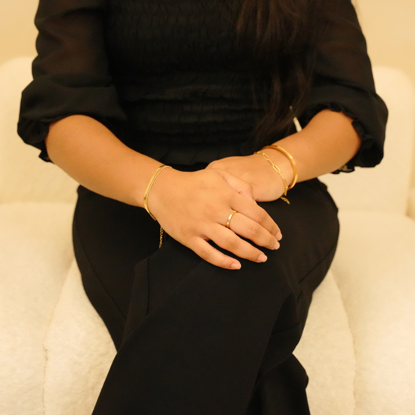 Gold bracelet featuring a delicate chain design and minimalist style.