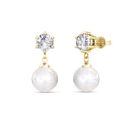 Gold earrings with clear gemstones and white pearls on a white background