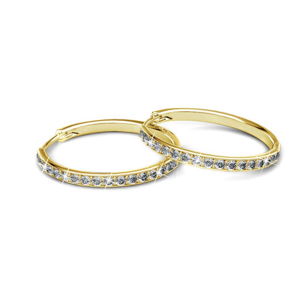Gold hoop earrings with embedded stones on a white background