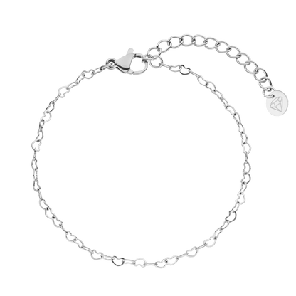 Silver heart chain bracelet by Unlimited, featuring a lobster clasp and extension chain.