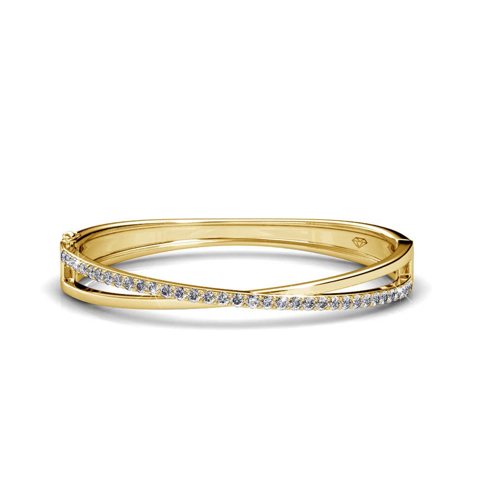 Gold bracelet with small diamonds on a white background