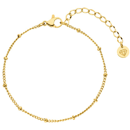 Gold beaded bracelet by Steeltime with a lobster claw clasp and diamond charm.