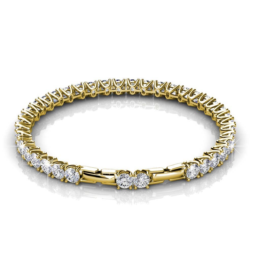 Gold bracelet with clear gemstones on a white background