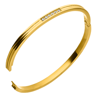 Gold bracelet by Six Stone, embellished with sparkling stones.
